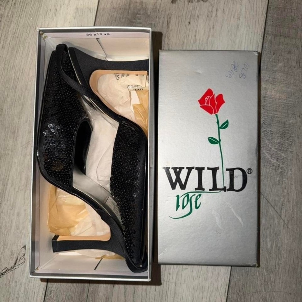 Black sequin wedge heels with a pointed toe and ankle strap. Size: US 8